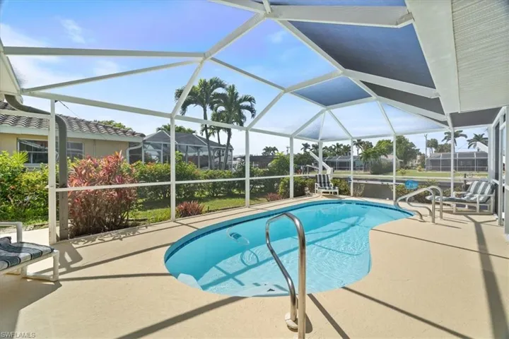 Pool with a lanai and a patio area