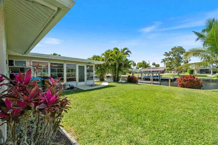 View of yard with a water view