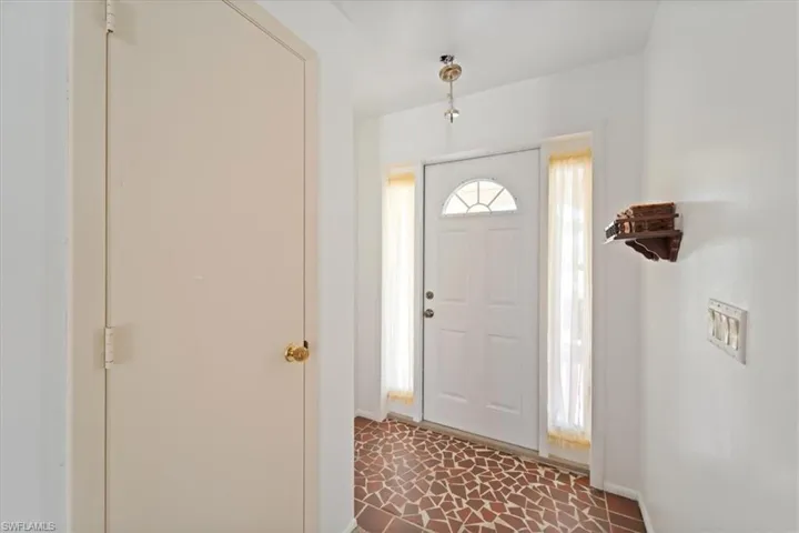 Entrance foyer featuring baseboards