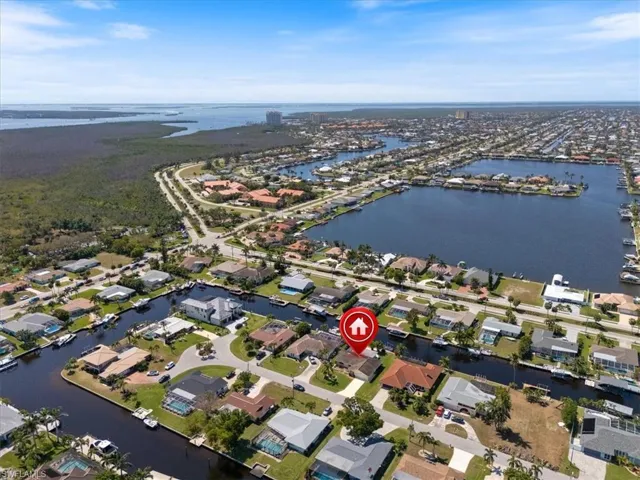 Drone / aerial view with a water view and a residential view