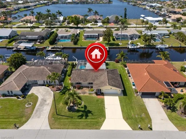 Aerial view featuring a residential view and a water view