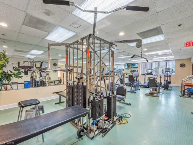 Gym with a paneled ceiling