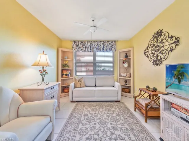 Living room with tile floors and ceiling fan