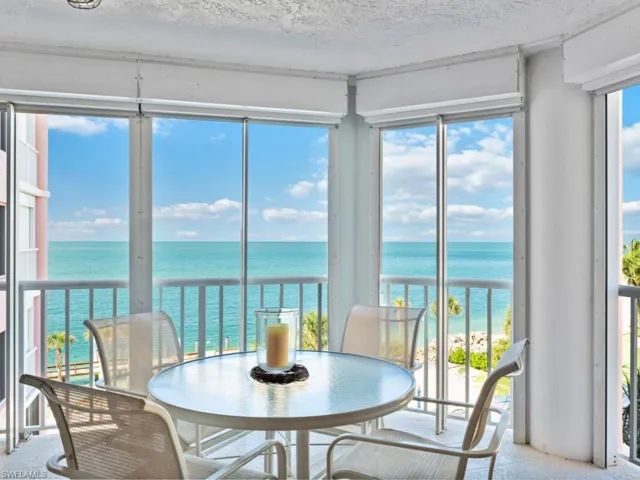 Sunroom / solarium with a water view