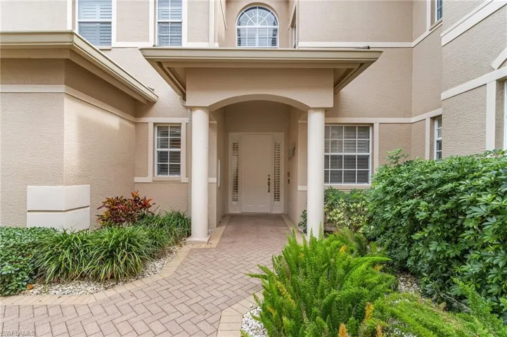 Doorway to property with stucco siding