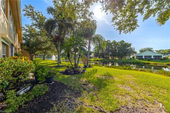 View of grassy yard featuring a water view