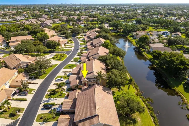 Aerial view of residential area featuring a large body of water