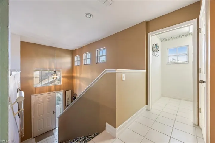Tiled entryway featuring healthy amount of natural light