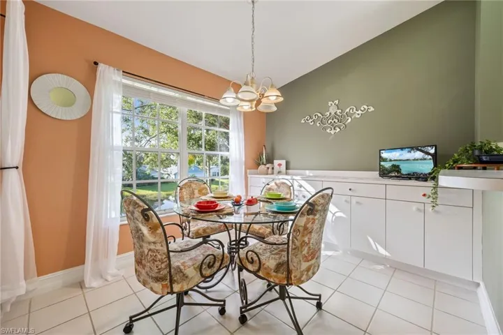 Dining space with a chandelier and light tile patterned floors