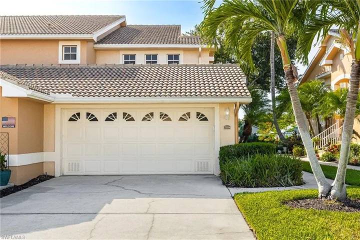 View of front of home featuring stucco siding, concrete driveway, an attached garage, and a tile roof