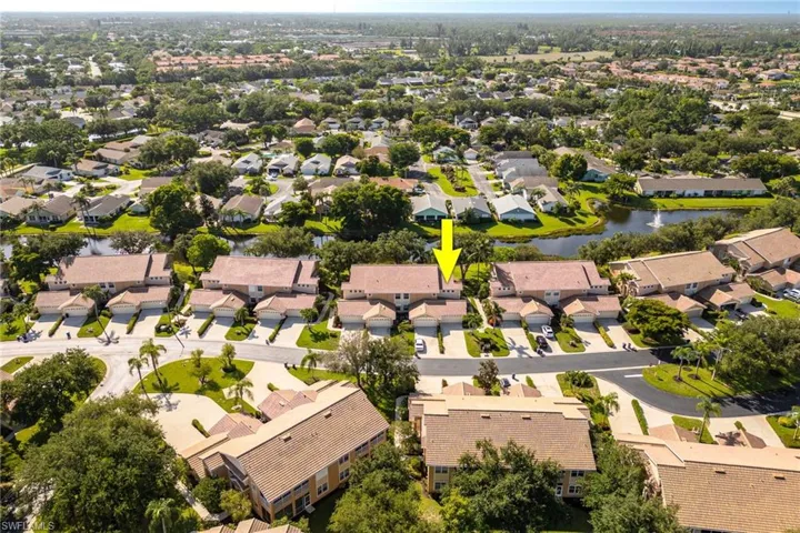 Aerial perspective of suburban area with a large body of water