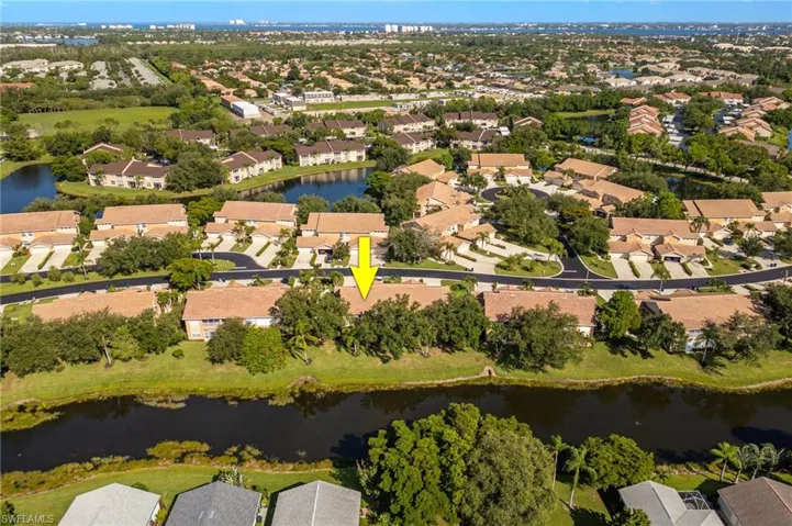 Aerial view of property's location with nearby suburban area