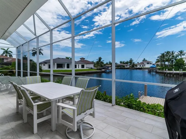 Sunroom with a water view