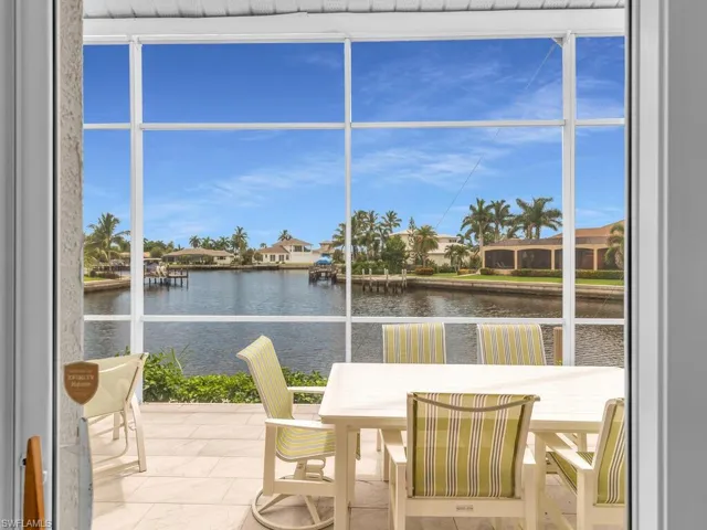 Sunroom with a water view