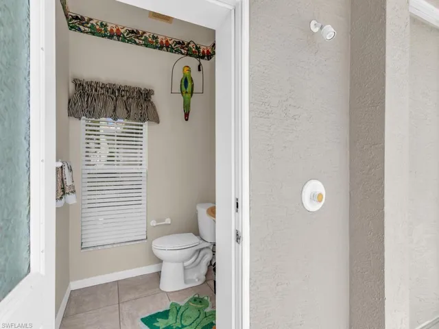 Bathroom with tile patterned floors and toilet