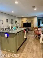 Kitchen featuring light hardwood / wood-style flooring and sink