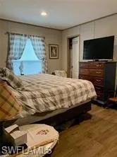 Bedroom featuring hardwood / wood-style flooring