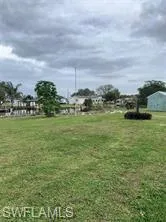 View of property's community featuring a lawn