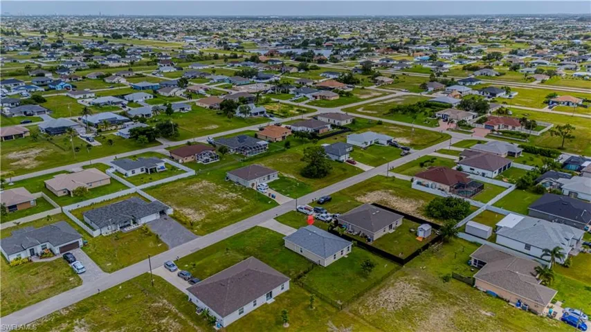 Aerial overview of property's location with nearby suburban area