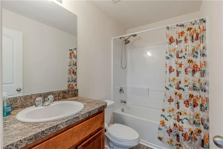 GUEST Full bathroom with vanity and shower / tub combo