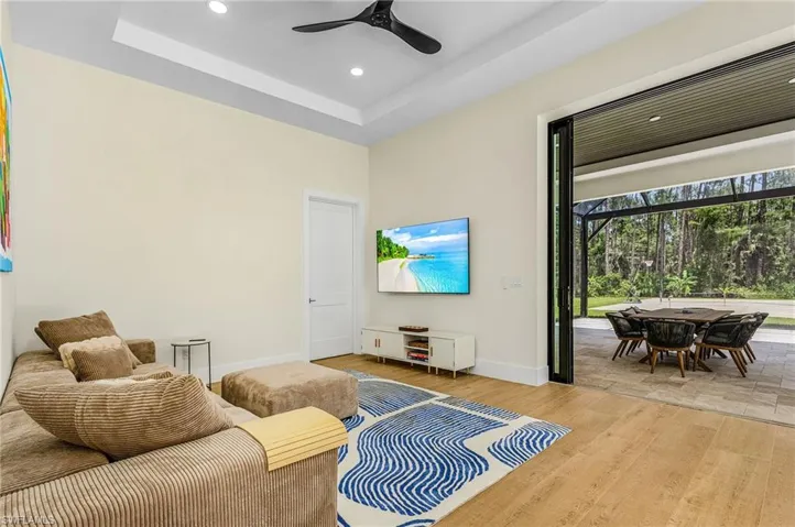 Rec Room opens beautifully to the pool and outdoor dining area. Door by TV is to the HOME THEATRE!