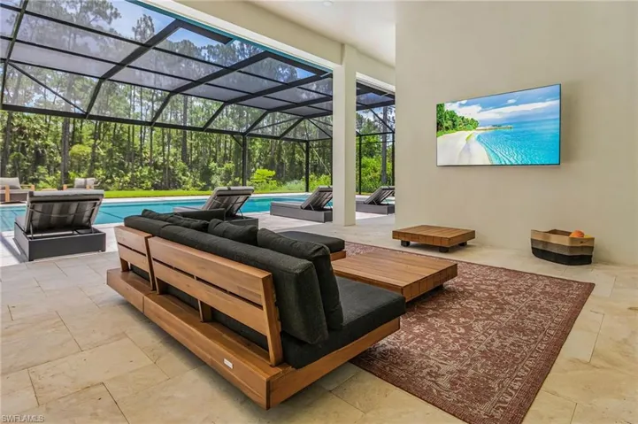 covered patio lounge area with TV