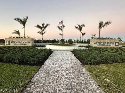 View of property's community with a yard