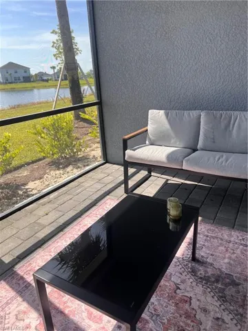 Sunroom with a lake view