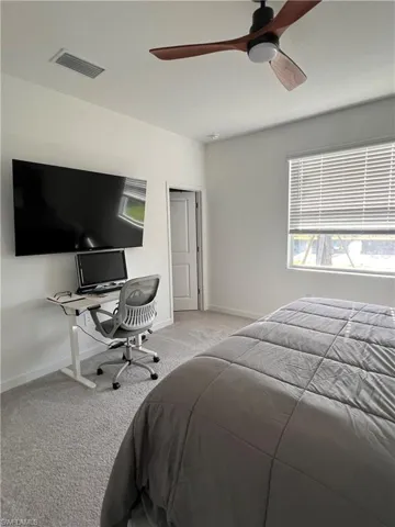 Bedroom featuring carpet floors and a ceiling fan