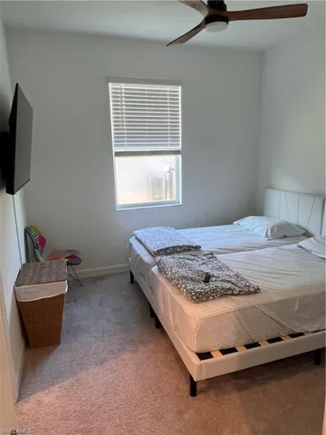 Bedroom featuring carpet floors and a ceiling fan
