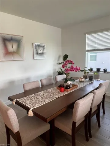 Dining area featuring wood finished floors and baseboards
