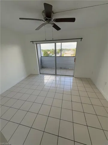 Unfurnished room with baseboards and light tile patterned floors
