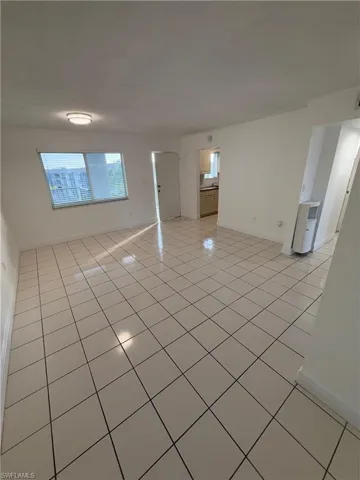 Empty room featuring light tile patterned floors
