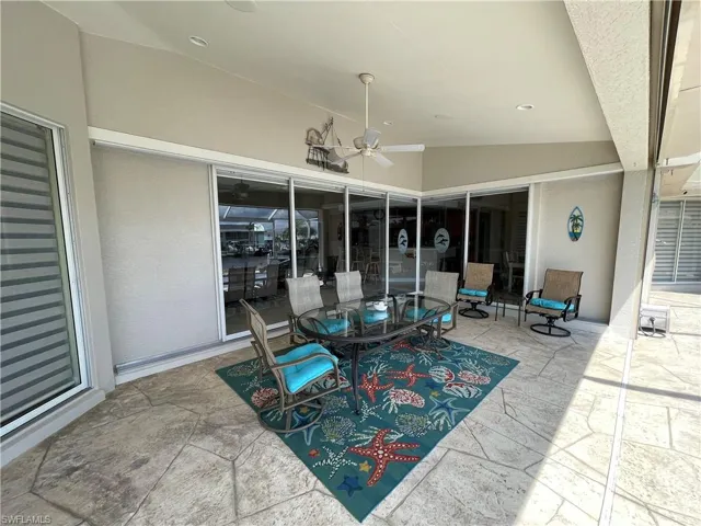 View of patio featuring ceiling fan