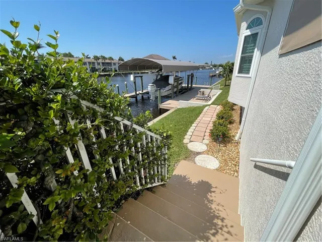 View of dock featuring a water view and boat lift