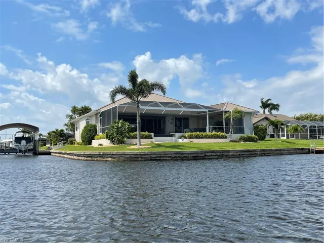 View of home featuring canals on 2 sides of this spacious corner home