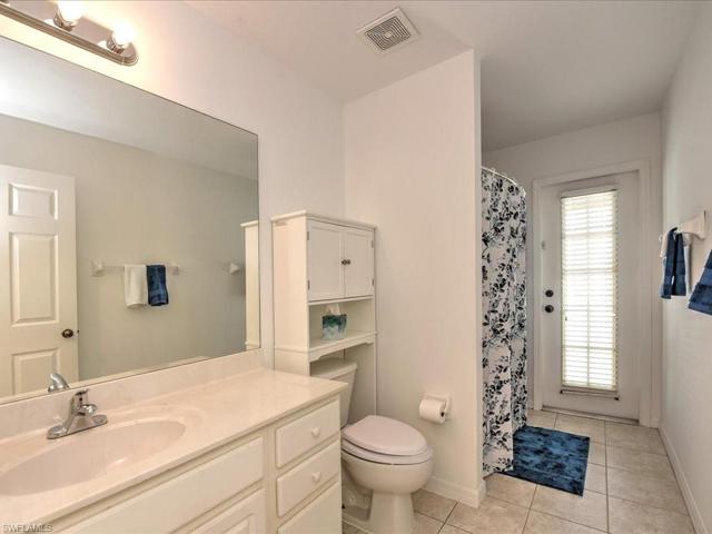 Full Guest Bath by 2 bedrooms and direct access to pool area