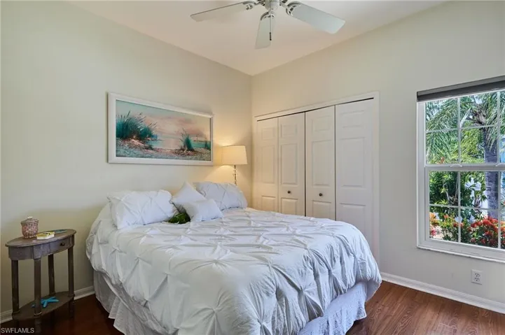 Bedroom featuring a closet, wood finished floors, and ceiling fan
