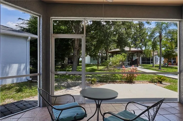 Sunroom featuring tile patterned floors