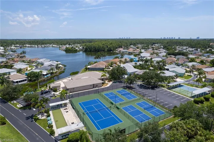 Aerial view of residential area featuring a large body of water