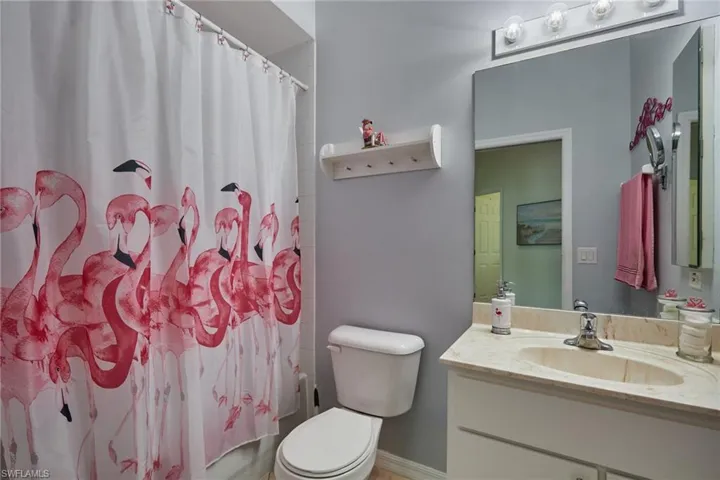 Full bath featuring vanity and shower / tub combo
