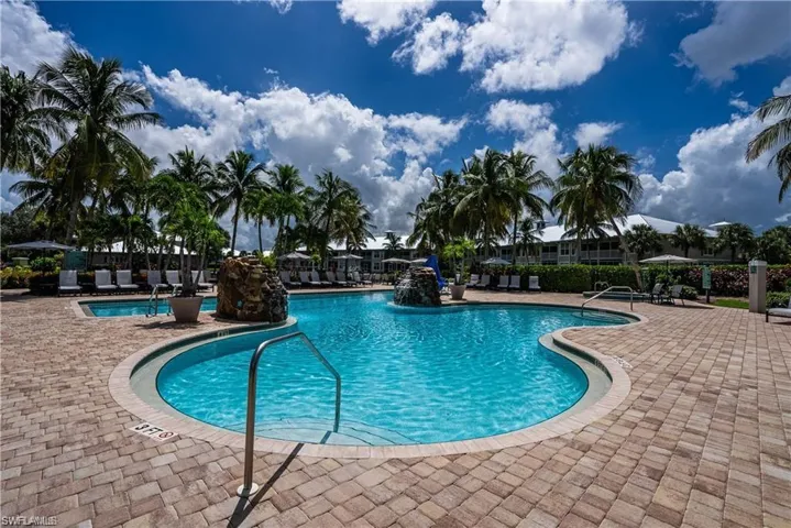 Community pool featuring a patio