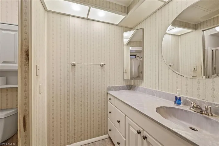 Bathroom with vanity and toilet
