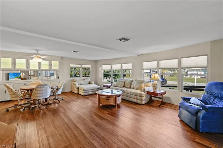 Living room featuring hardwood / wood-style flooring and ceiling fan