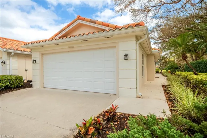 Garage featuring driveway