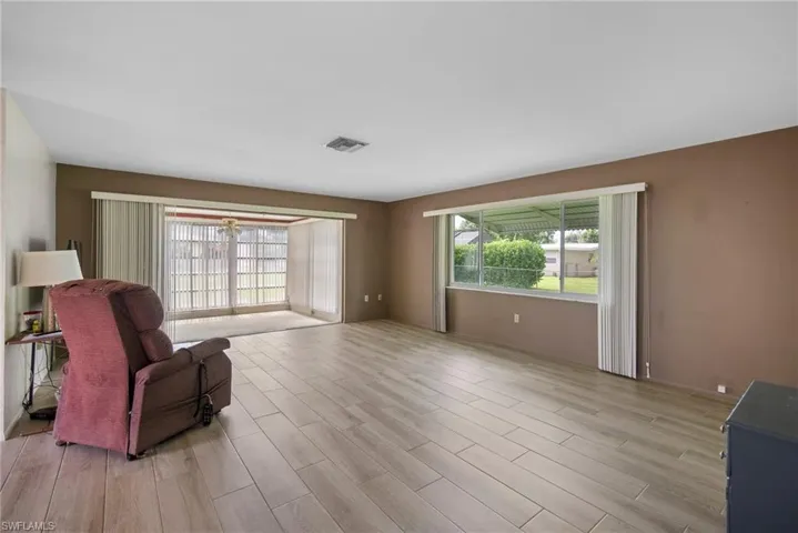 Living room with light hardwood / wood-style flooring