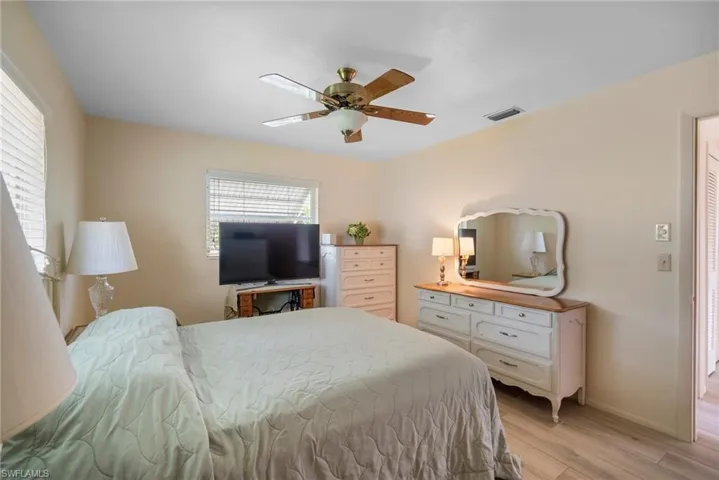 Bedroom featuring light wood-type flooring and ceiling fan