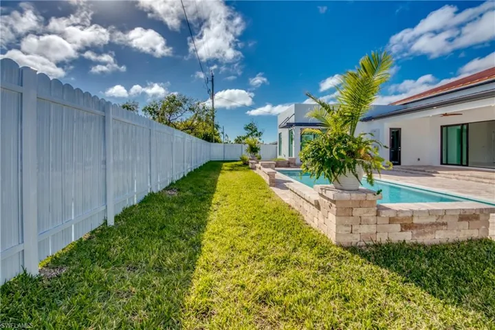 View of yard with a patio and a fenced in pool
