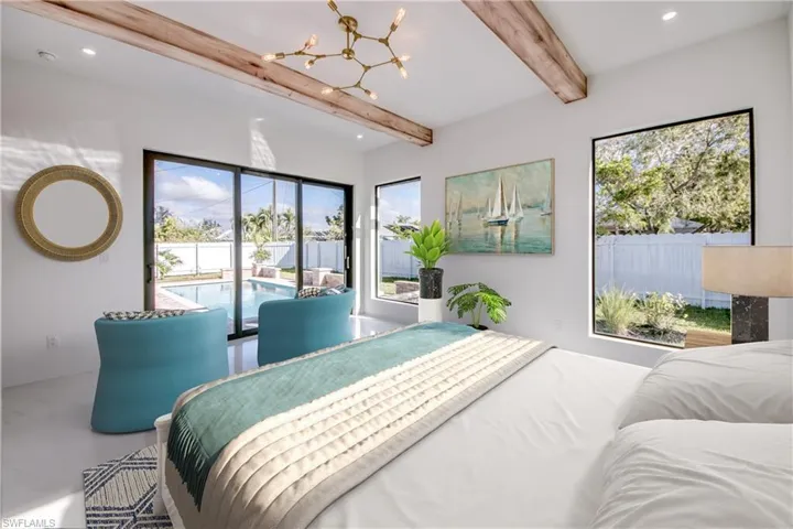 Virtually staged Bedroom featuring access to exterior, concrete floors, a chandelier, and beamed ceiling