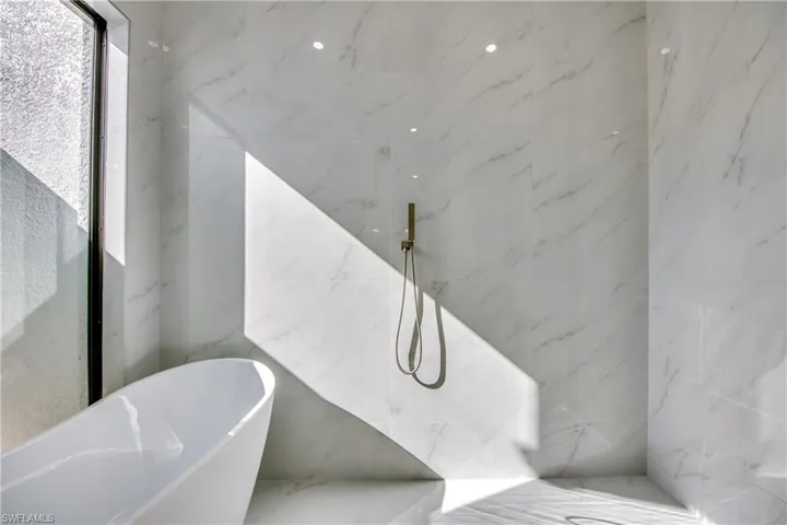 Bathroom with shower with separate bathtub